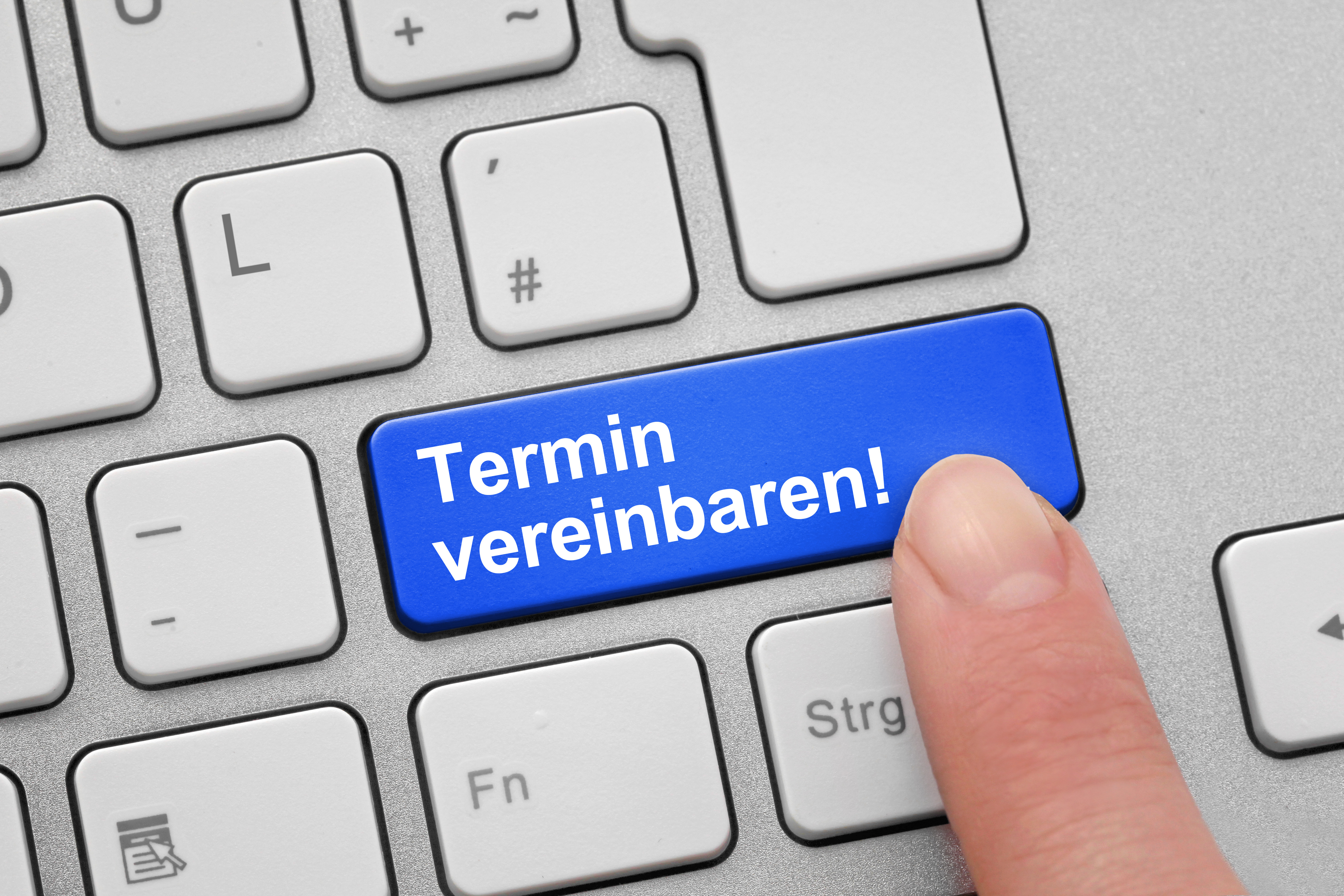 Eine Tastatur mit einer Taste zur Terminvereinbarung